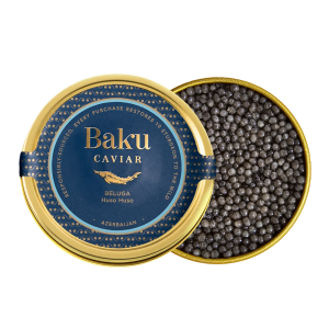 Baku Caviar Beluga tin beside an open tin of dark Huso huso beluga caviar pearls