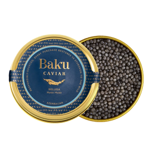 Baku Caviar Beluga tin beside an open tin of dark Huso huso beluga caviar pearls